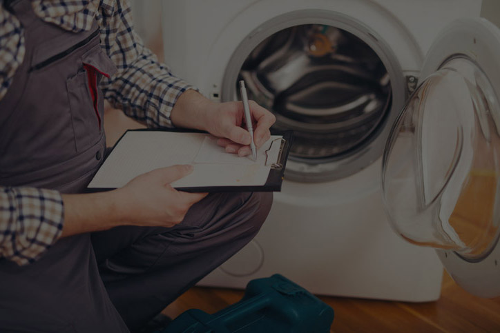 Technician repairing a home appliance.